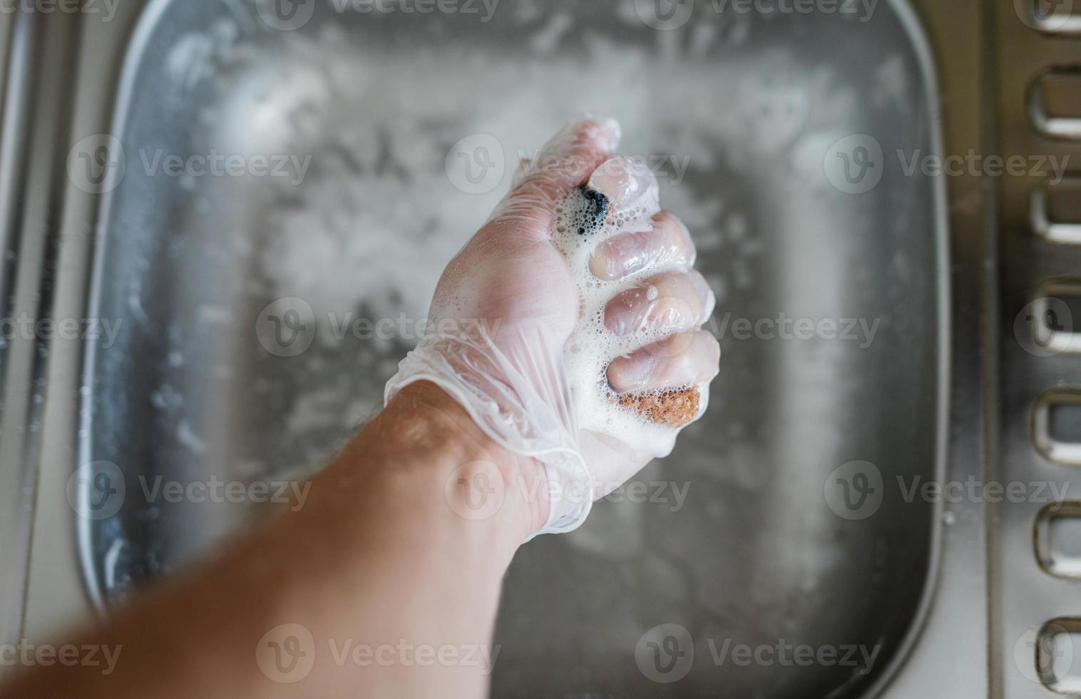 Cleaning kitchen sink. photo
