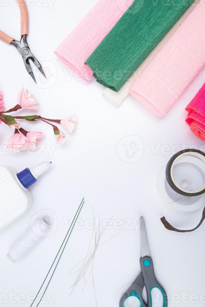 Tools and materials for creating a spring branch with sakura flowers from corrugated paper. Do it yourself photo