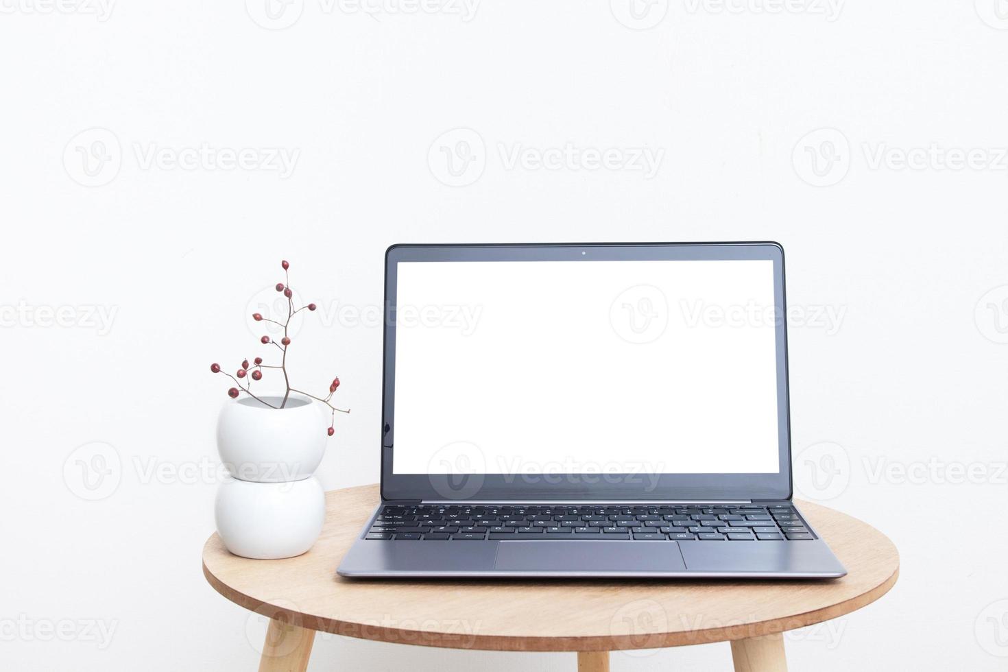 Blank modern laptop screen mockup in minimalistic interior design for displaying your website or advertising internet services photo