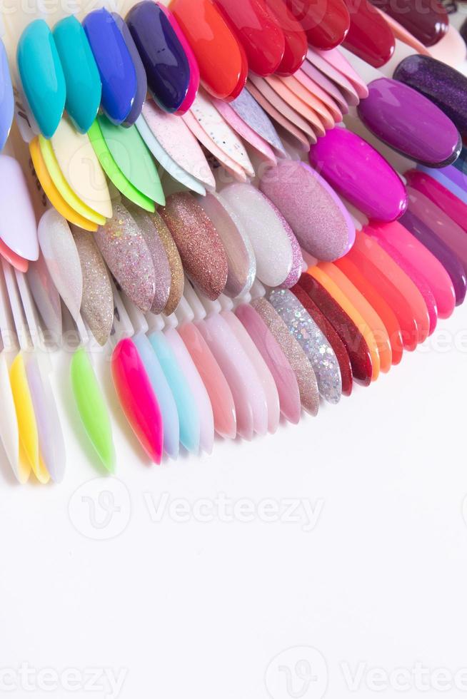 Color palette with nail gel polishes for manicure on a white background.. Vertical format photo