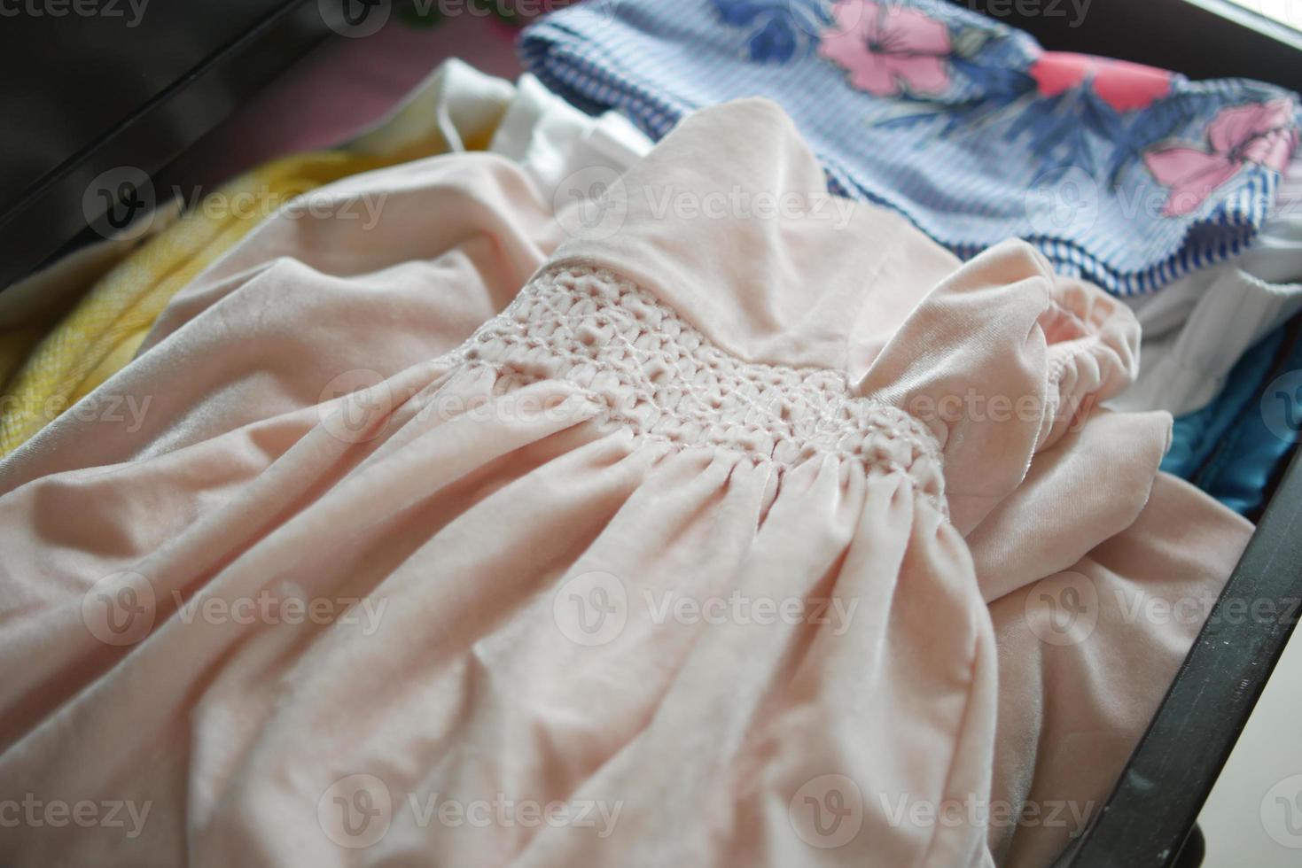 cloths in a open drawer wooden photo