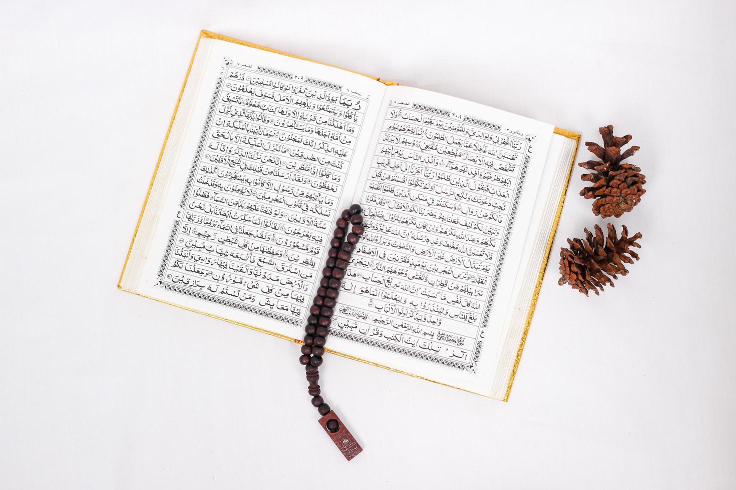 verses of the holy quran and tasbih isolated on white background photo
