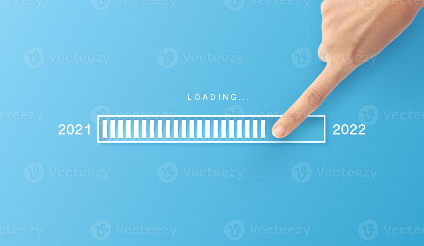 Loading new year 2021 to 2022 with hand point in progress bar. background for the holiday photo