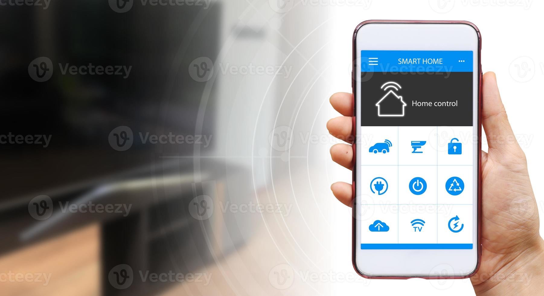 Hand of woman or man holding smartphone in house with icons in modern life internet of things, smart home technology. concept of automation. the new innovation of the future in living room photo