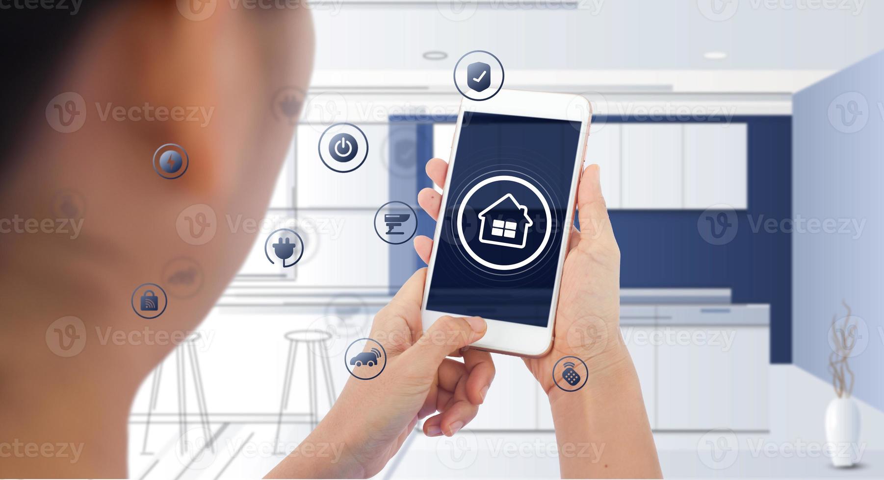 Hand of woman or man holding smartphone in house with icons in modern life internet of things, smart home technology. concept of automation. the new innovation of the future in living room photo