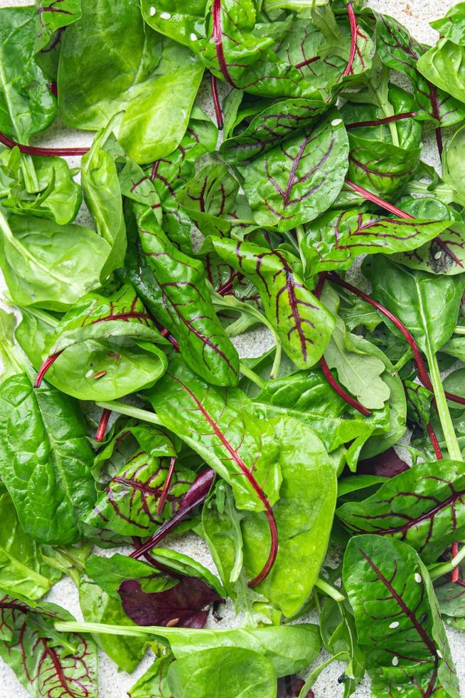 green salad leaves mix microgreen juicy snack ready eat on the table photo