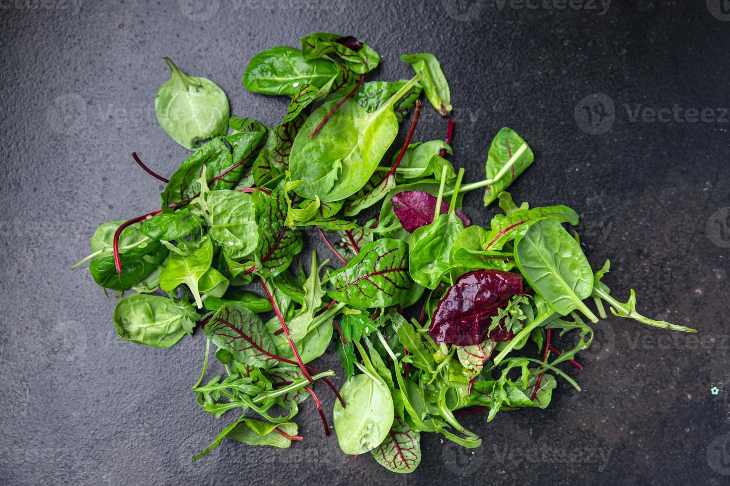 green salad leaves mix microgreen juicy snack ready eat on the table photo