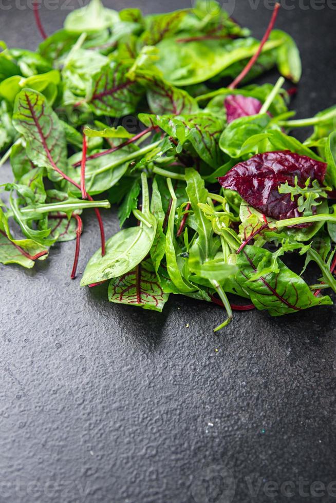 green salad leaves mix microgreen juicy snack ready eat on the table photo