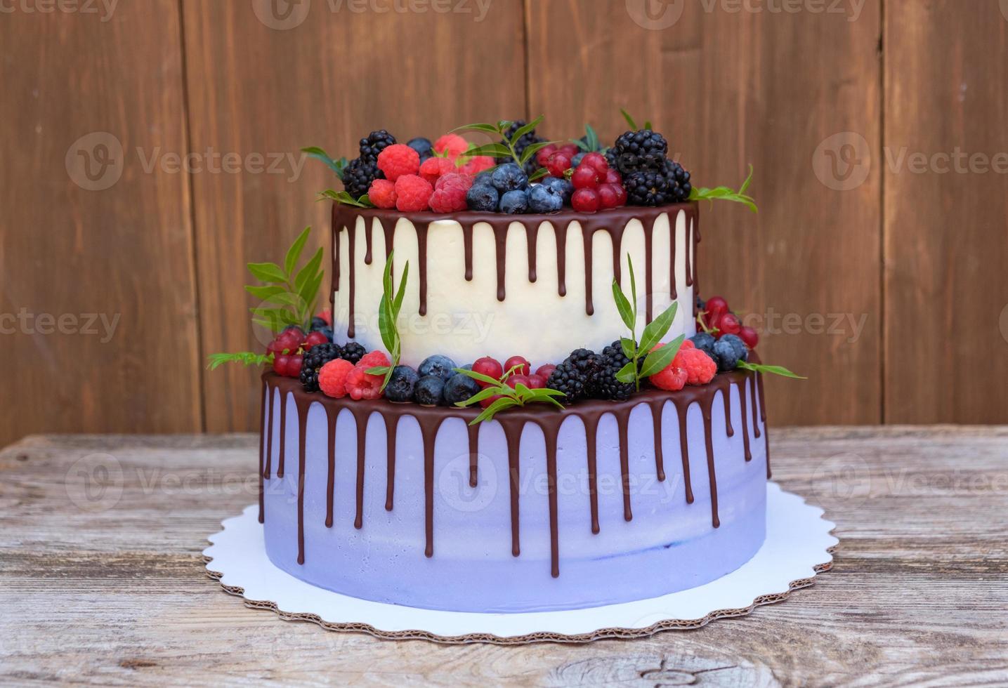 wedding cake in two tiers with fresh berries photo