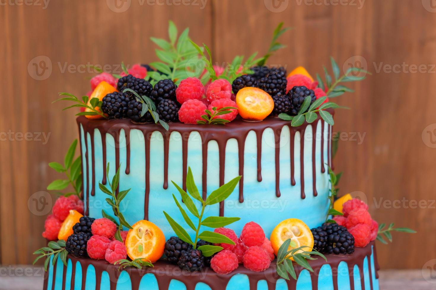 wedding cake in two tiers with fresh berries photo