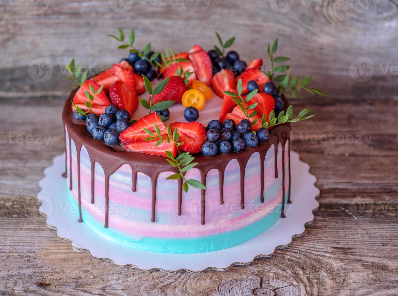 beautiful home made cake with pink and turquoise cream cheese frosting photo