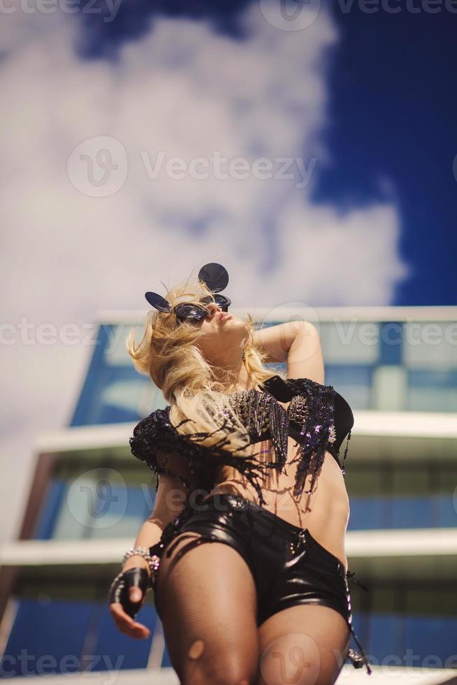 blonde standing on the roof photo