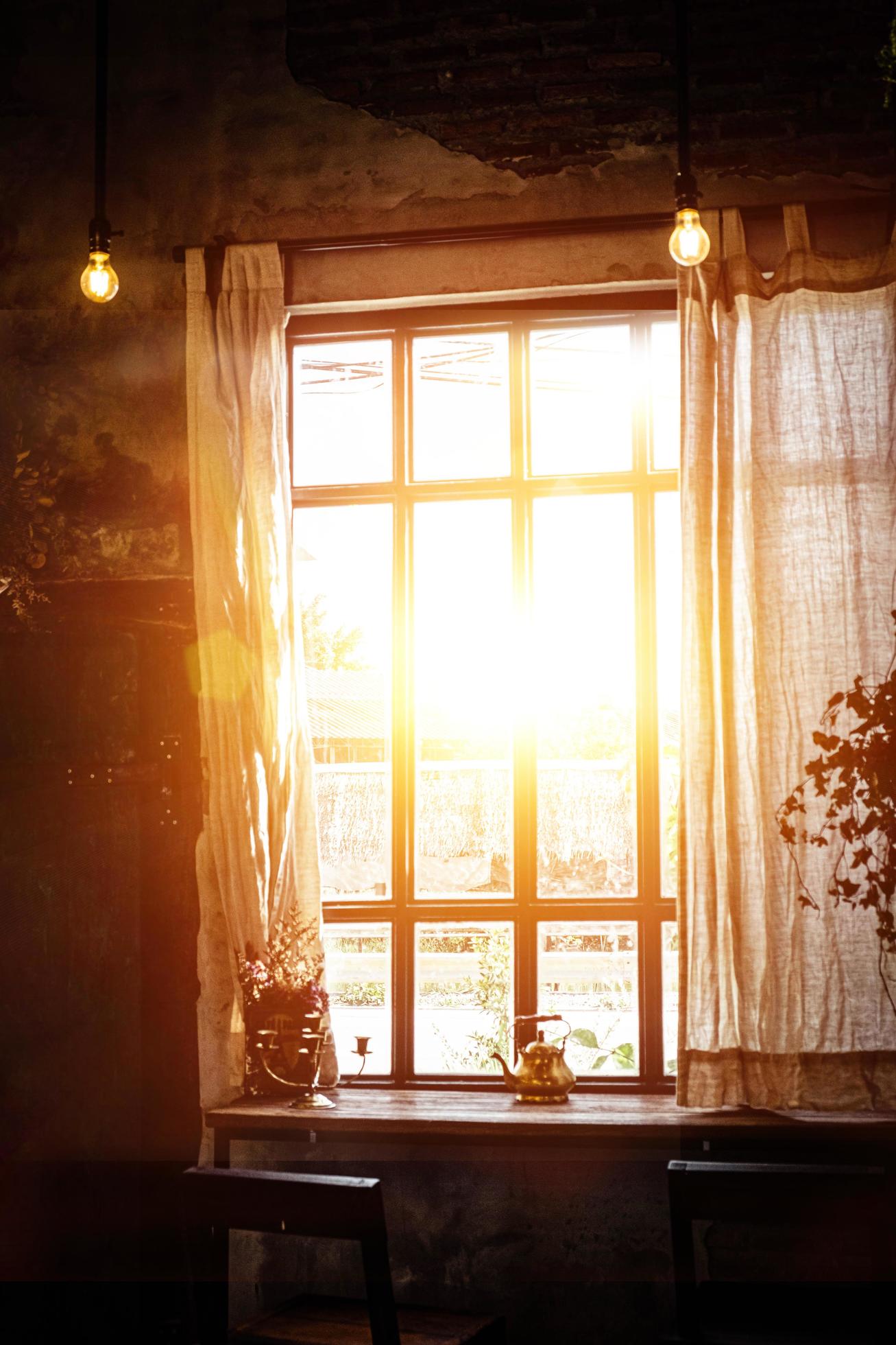Golden light through window inside room in the morning. Hommie house design. 5727090 Stock Photo