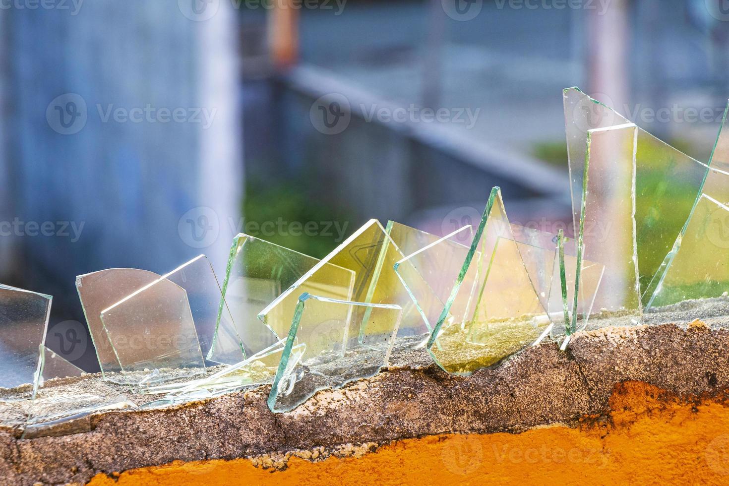 Dangerous wall with broken glass shards Playa del Carmen Mexico. photo