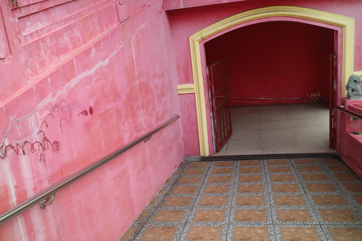 the door opens on the red wall photo