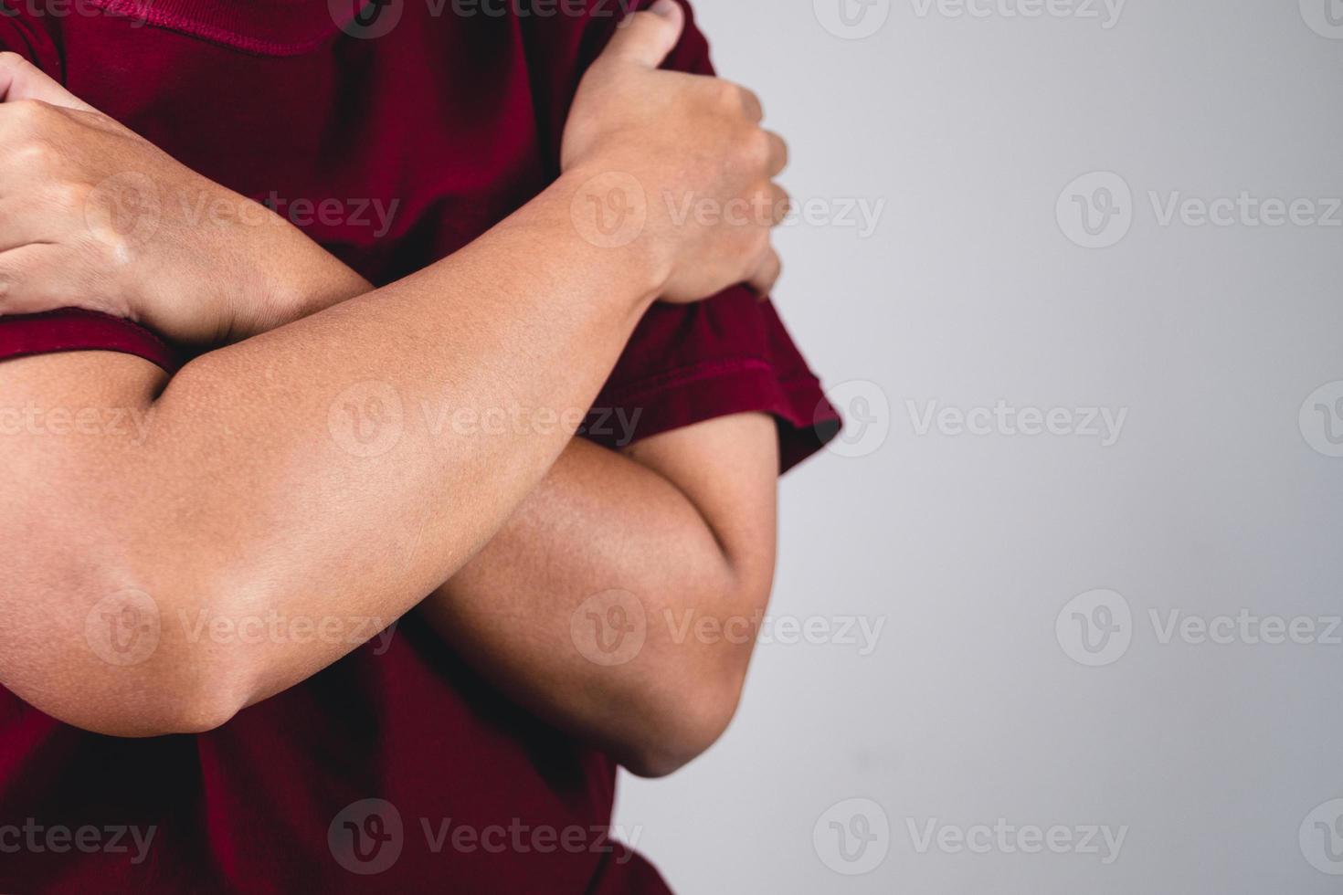 Sign of self love. Hug youself and Positive thinking. The man with red shirt in medium close up shot. Copy space for messages, words and texts. photo