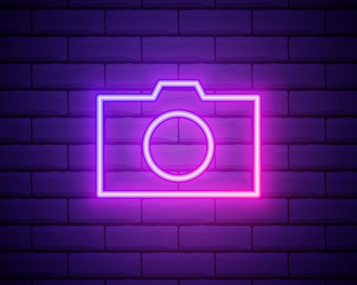 Neon illumination of the camera or camera. Bright is the camera. Modern vector logo, banner, emblem, poster, camera picture. Night neon sign. Light the inscription. Vector illustration.