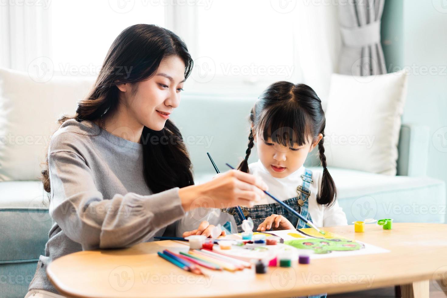 picture of mother and daughter drawing pictures photo