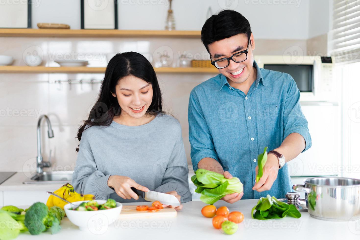 image of a couple cooking together photo