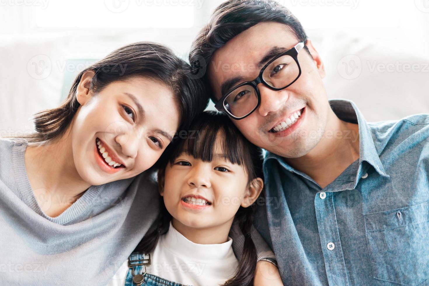 small asian family portrait at home photo