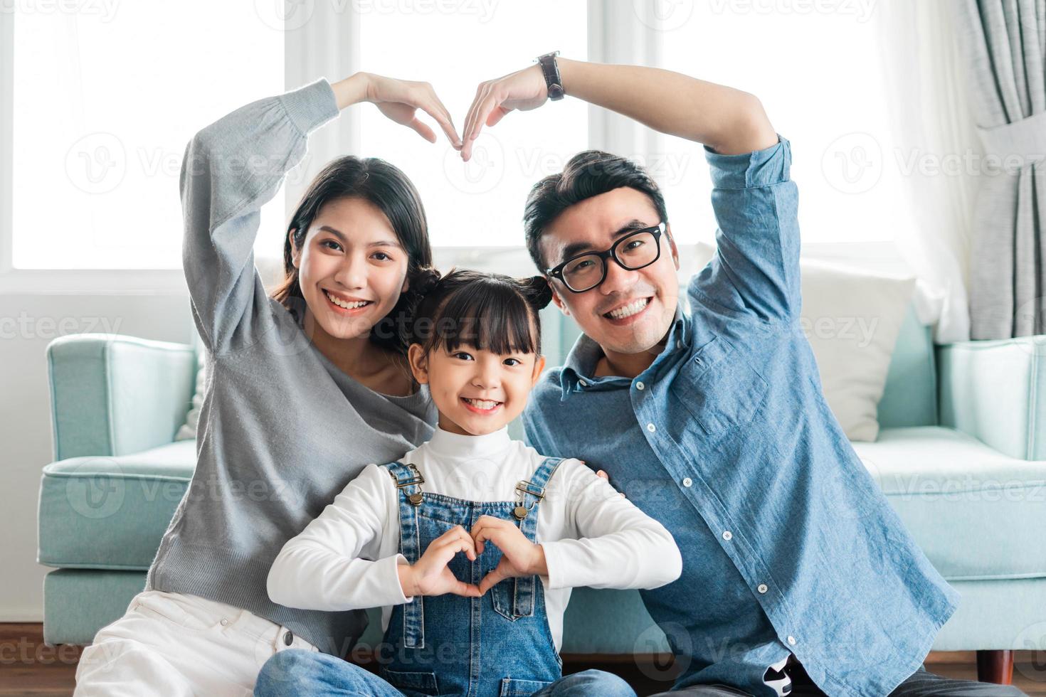 small asian family portrait at home photo