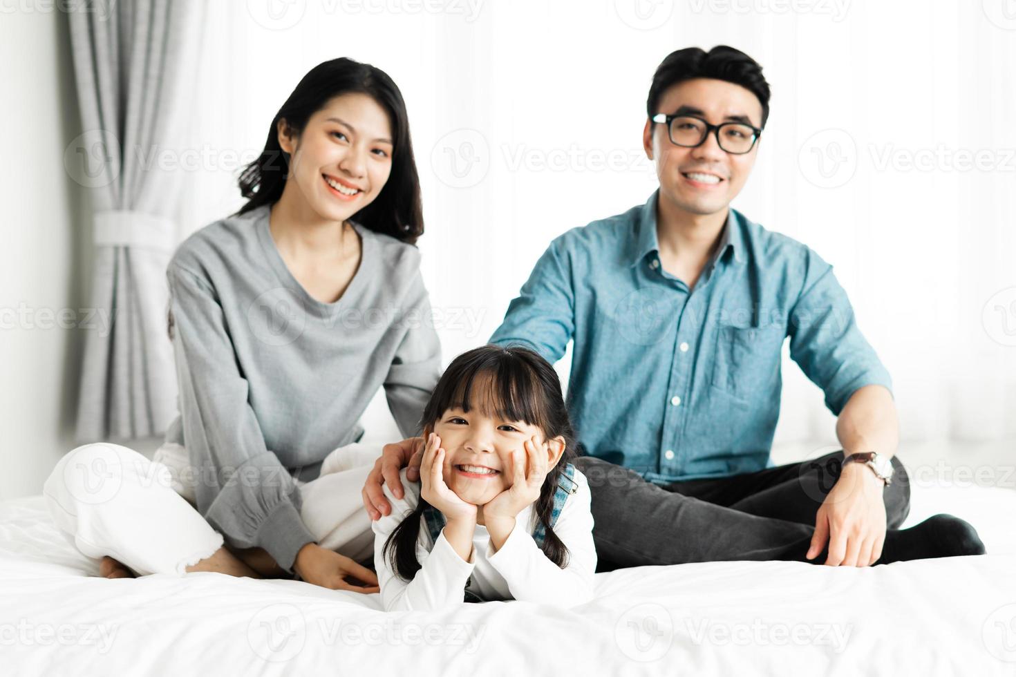 small asian family portrait at home photo