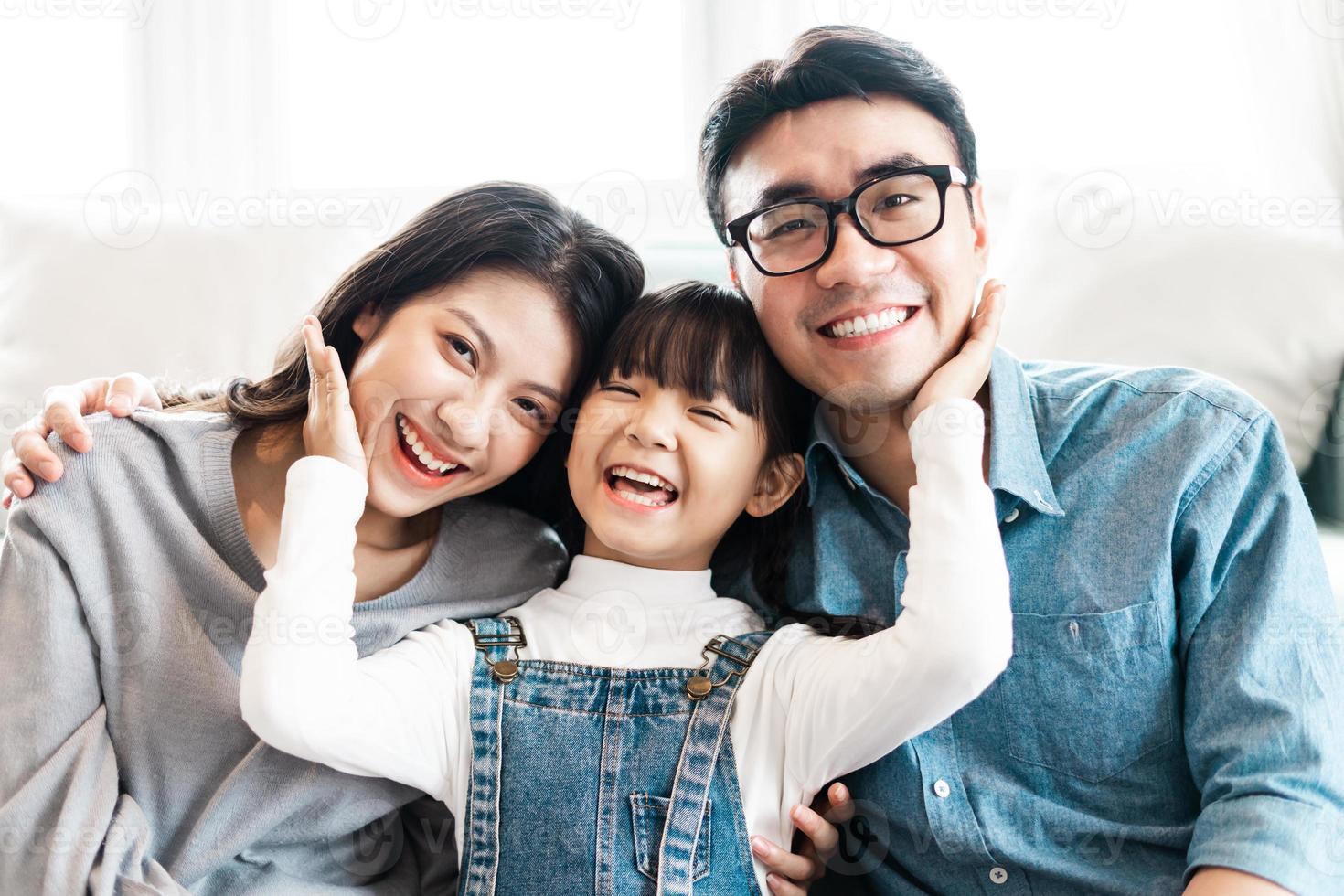 small asian family portrait at home photo