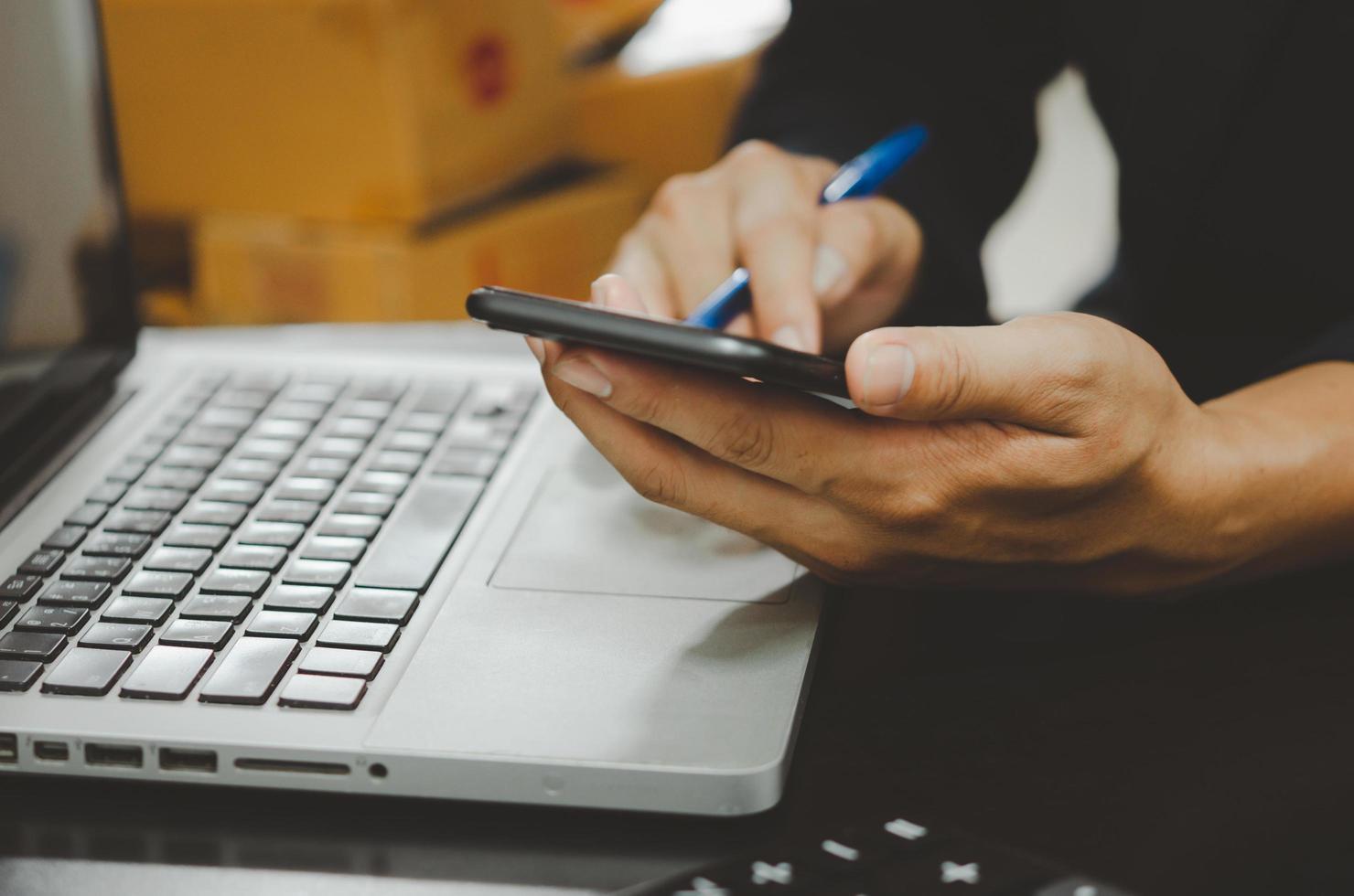 businessman using mobile and computer laptop online shopping or digital marketing technology concept. photo