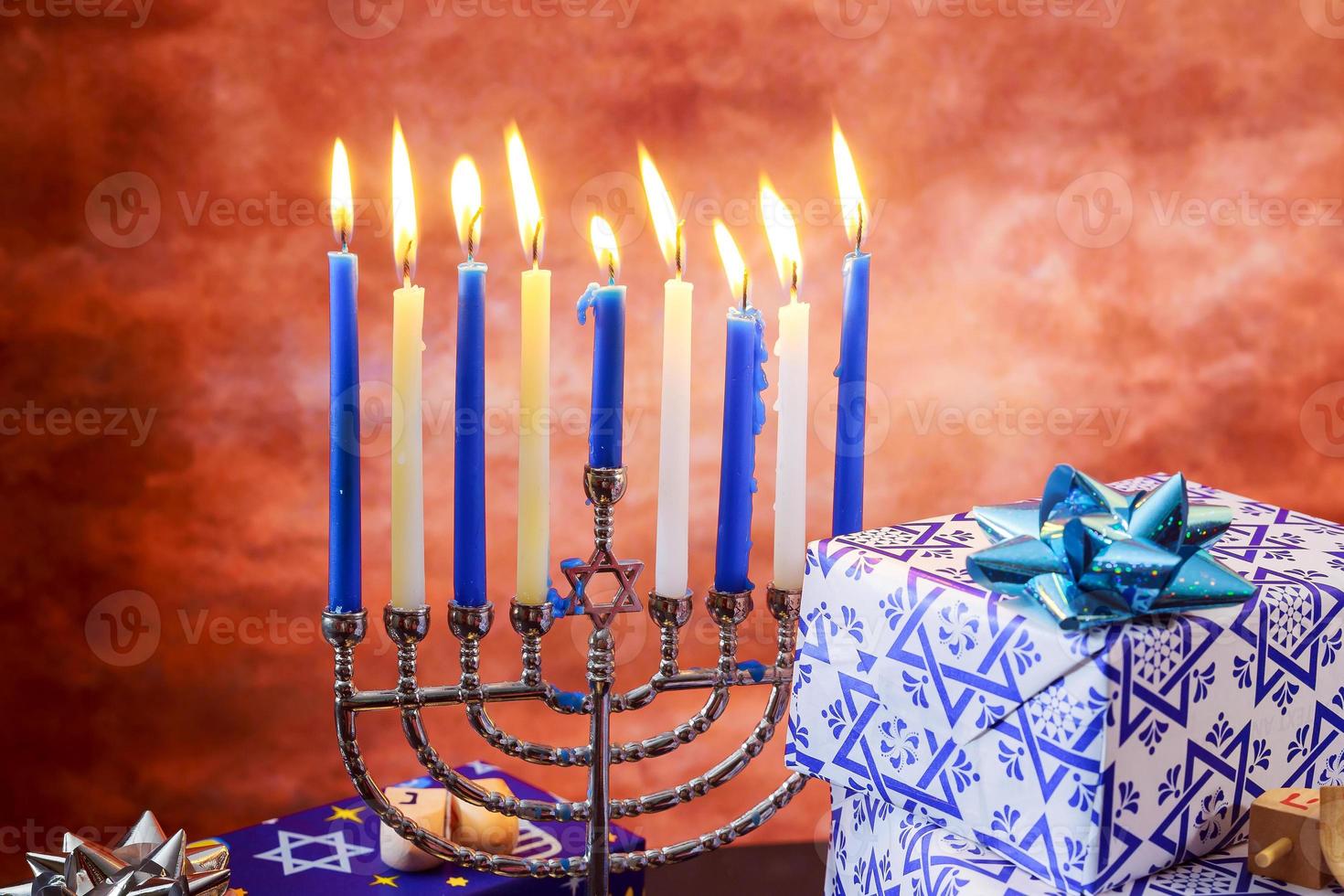 jewish holiday Hanukkah with menorah over wooden table photo