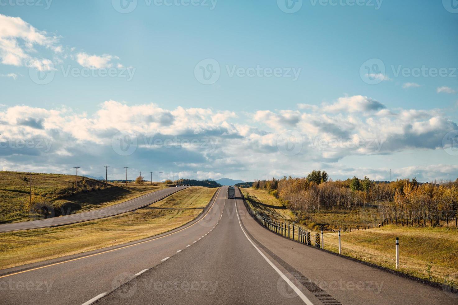 Scenery of the road and blue sky in national park on autumn photo