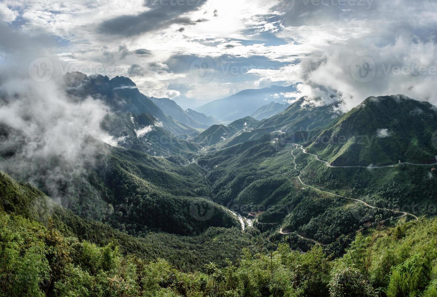 Scenery of Tram Ton Pass or O Quy Ho Pass is mountain pass winding in valley with foggy at Sapa, Northwest Vietnam photo