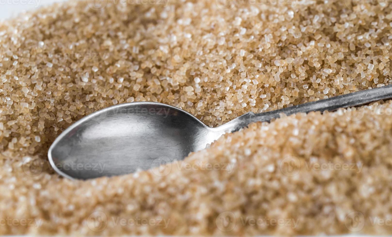 Spoon in brown sugar photo