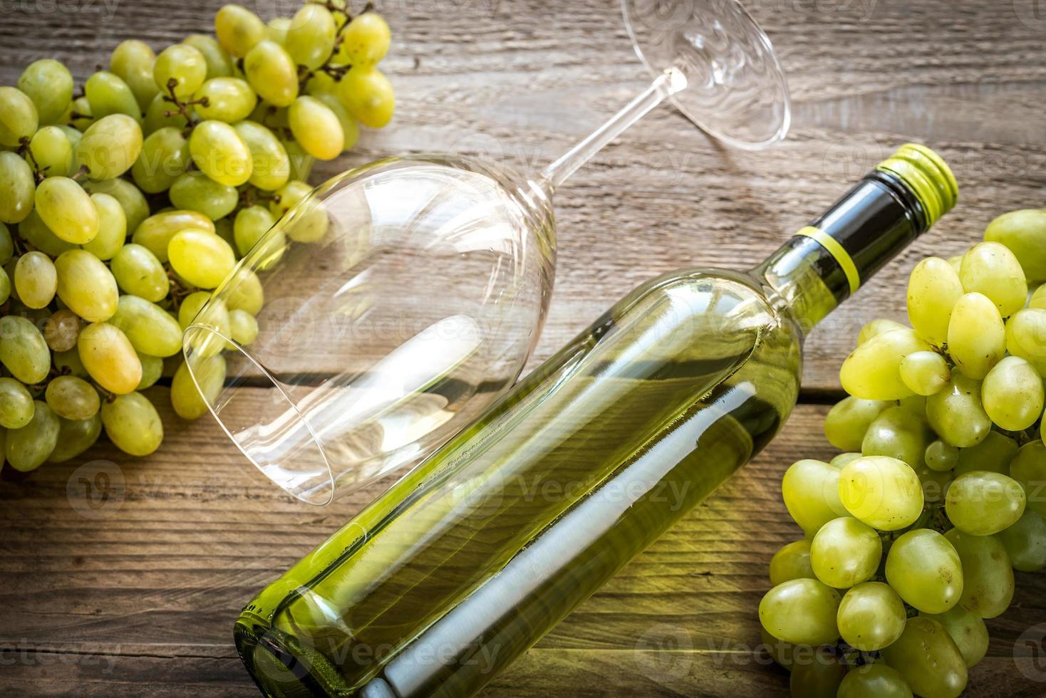 White wine with bunch of grape photo