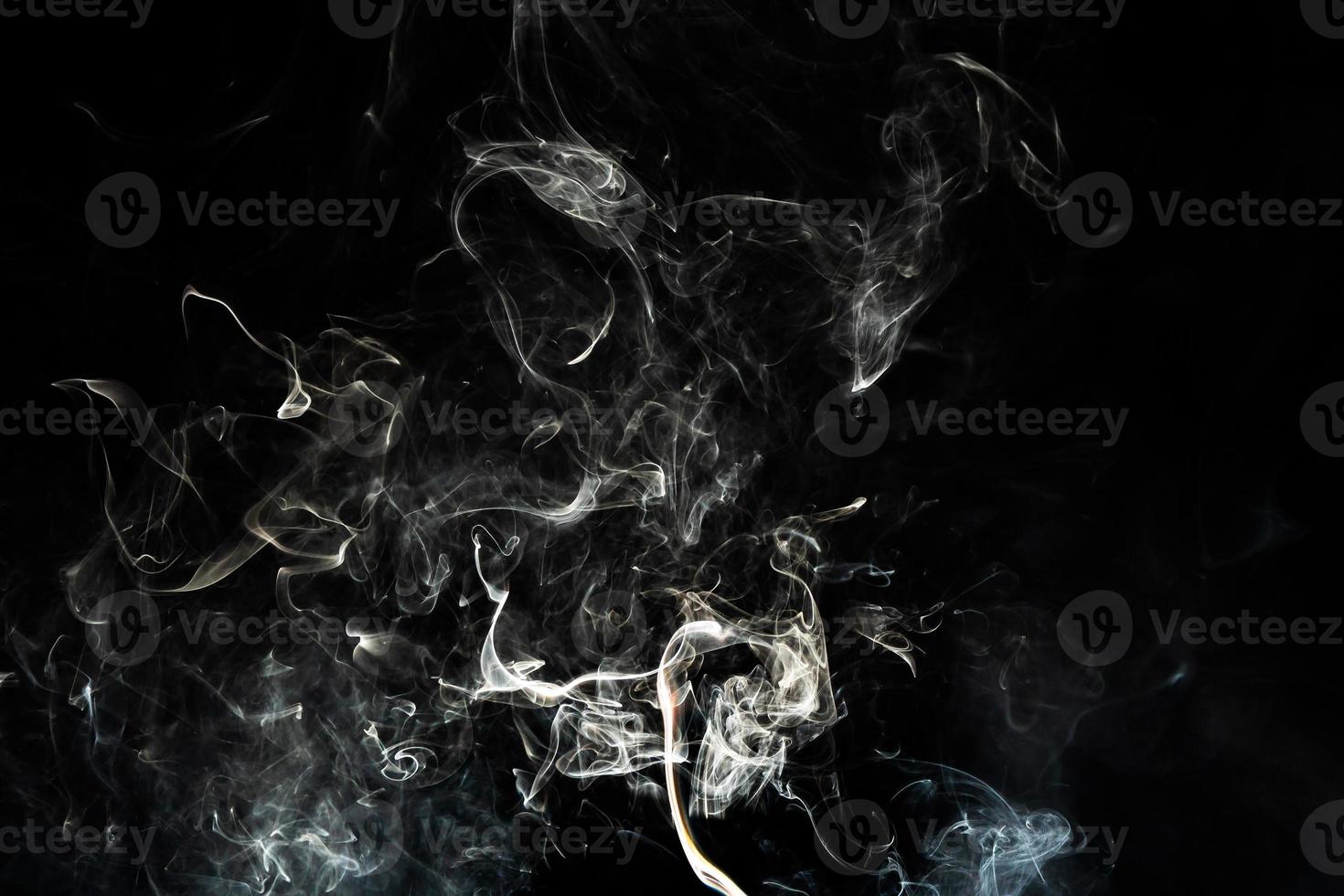 Smoke effect texture. Isolated background. Black and dark backdrop. Smokey fire and mistic effect. photo