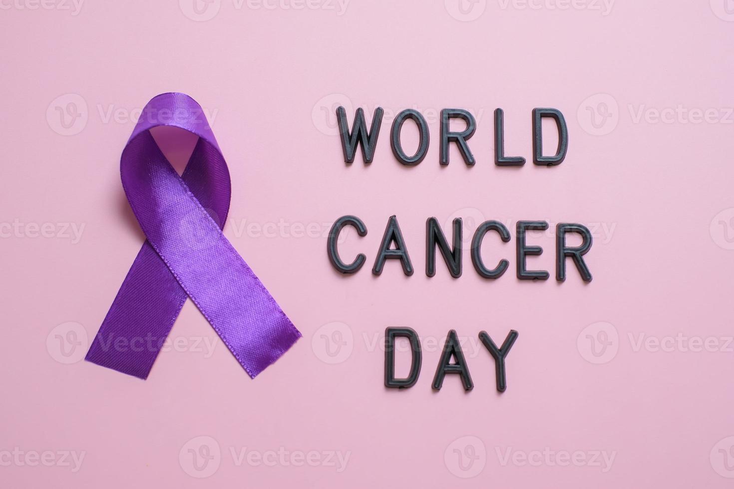 Purple ribbon as symbol of World Cancer Day concept photo