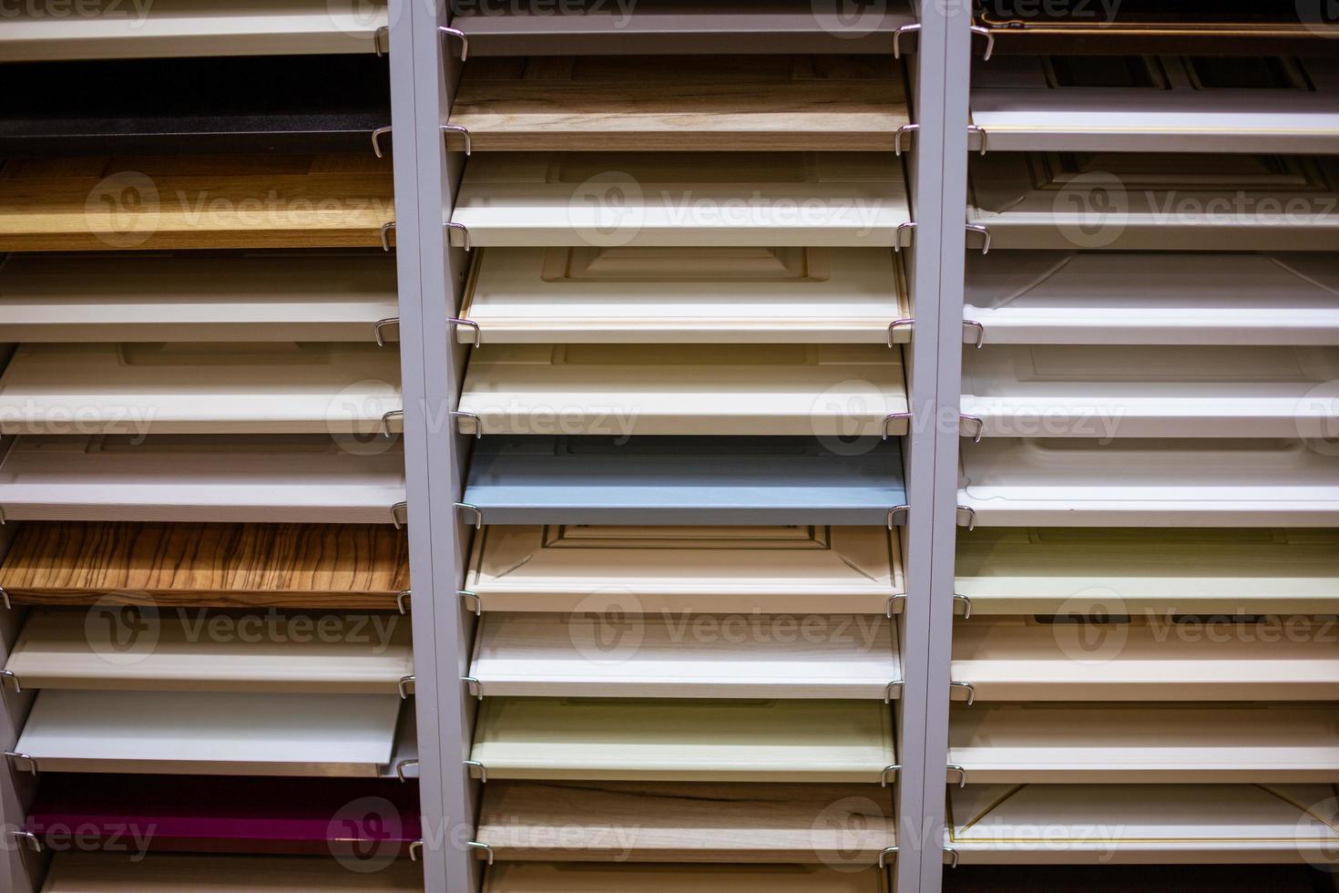 Shelves of different colors on the shelves in the store photo