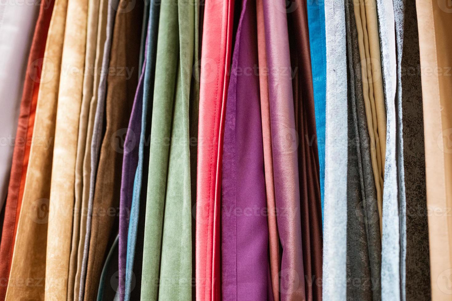 different types of curtains and fabrics hanging photo