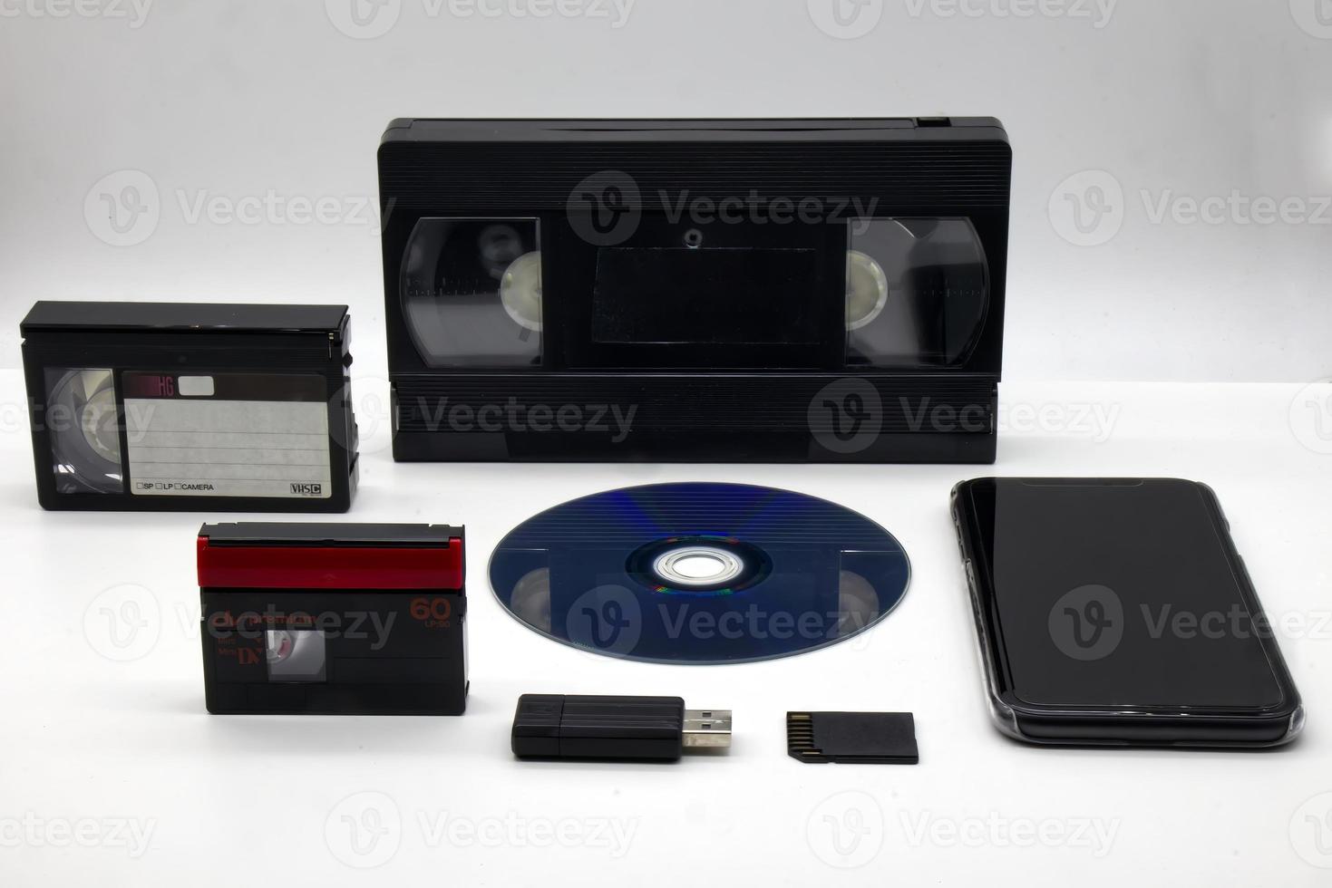 Evolution of media storage device on white background. Vintage Technology from the 90s until today. photo