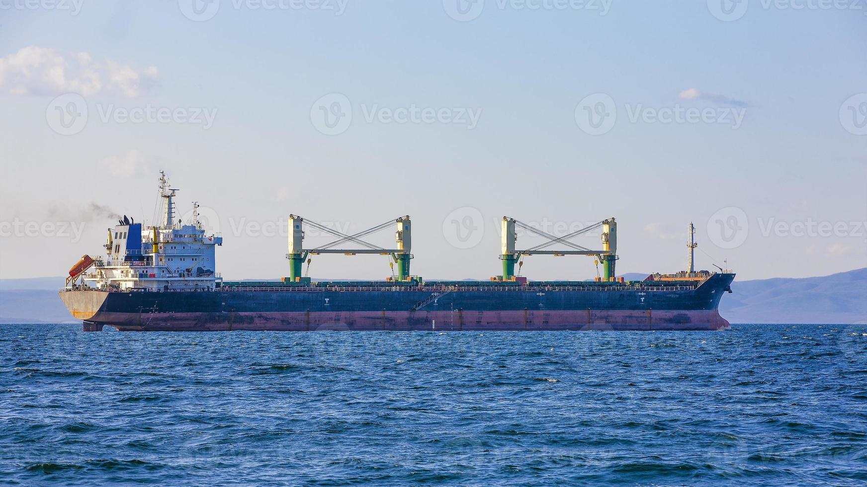 bulk cargo ship to harbor quayside Vladivostok photo
