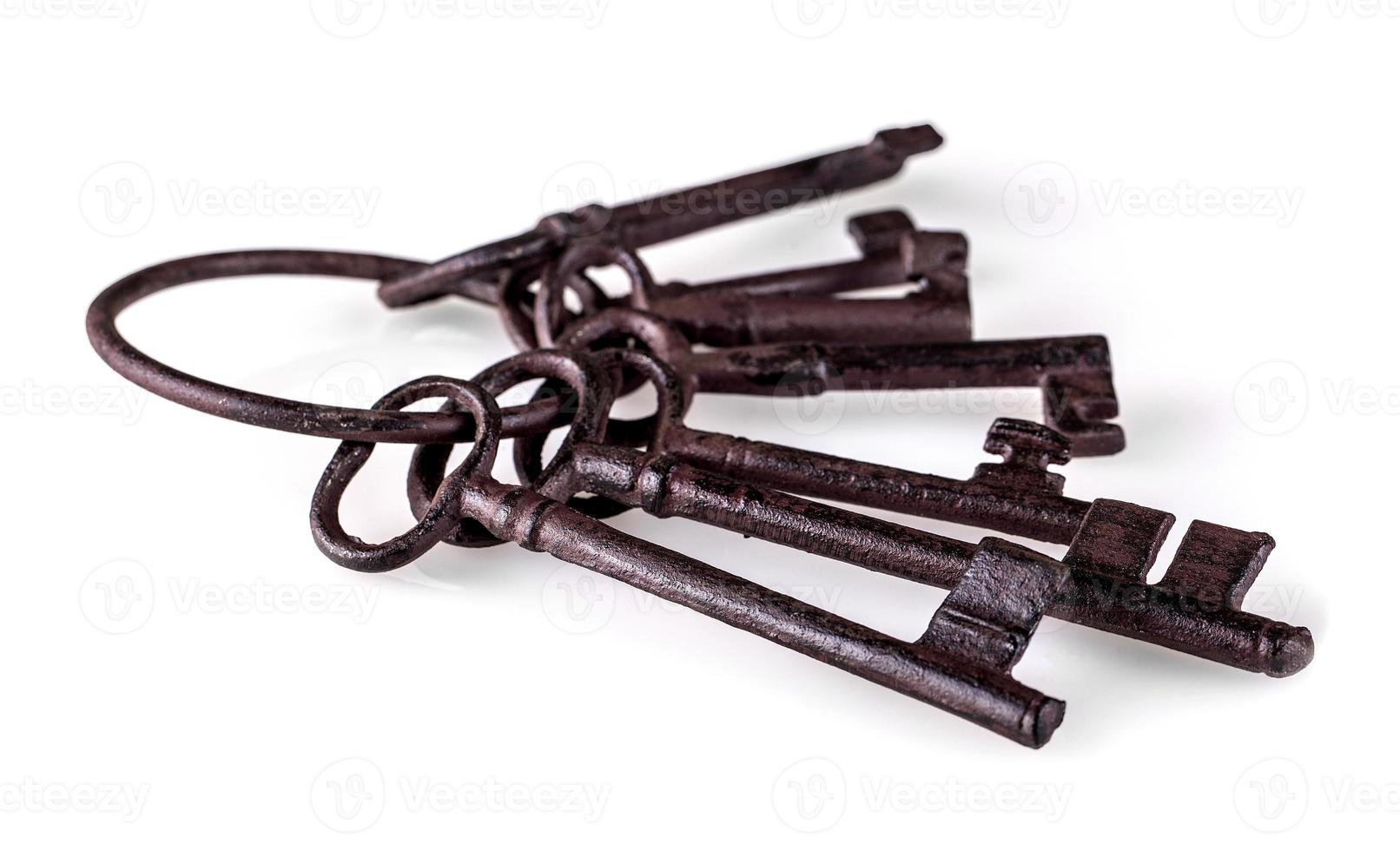 The old cast iron key on white background photo