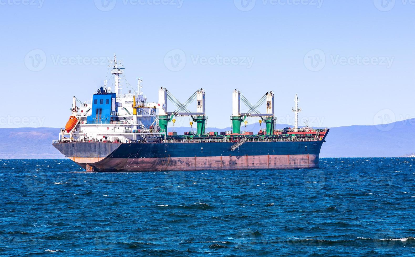 bulk cargo ship to harbor quayside Vladivostok photo