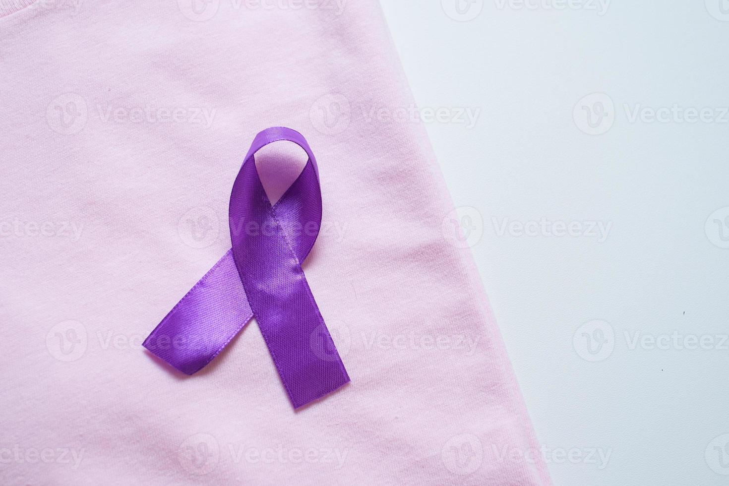 Purple ribbon as symbol of World Cancer Day concept photo