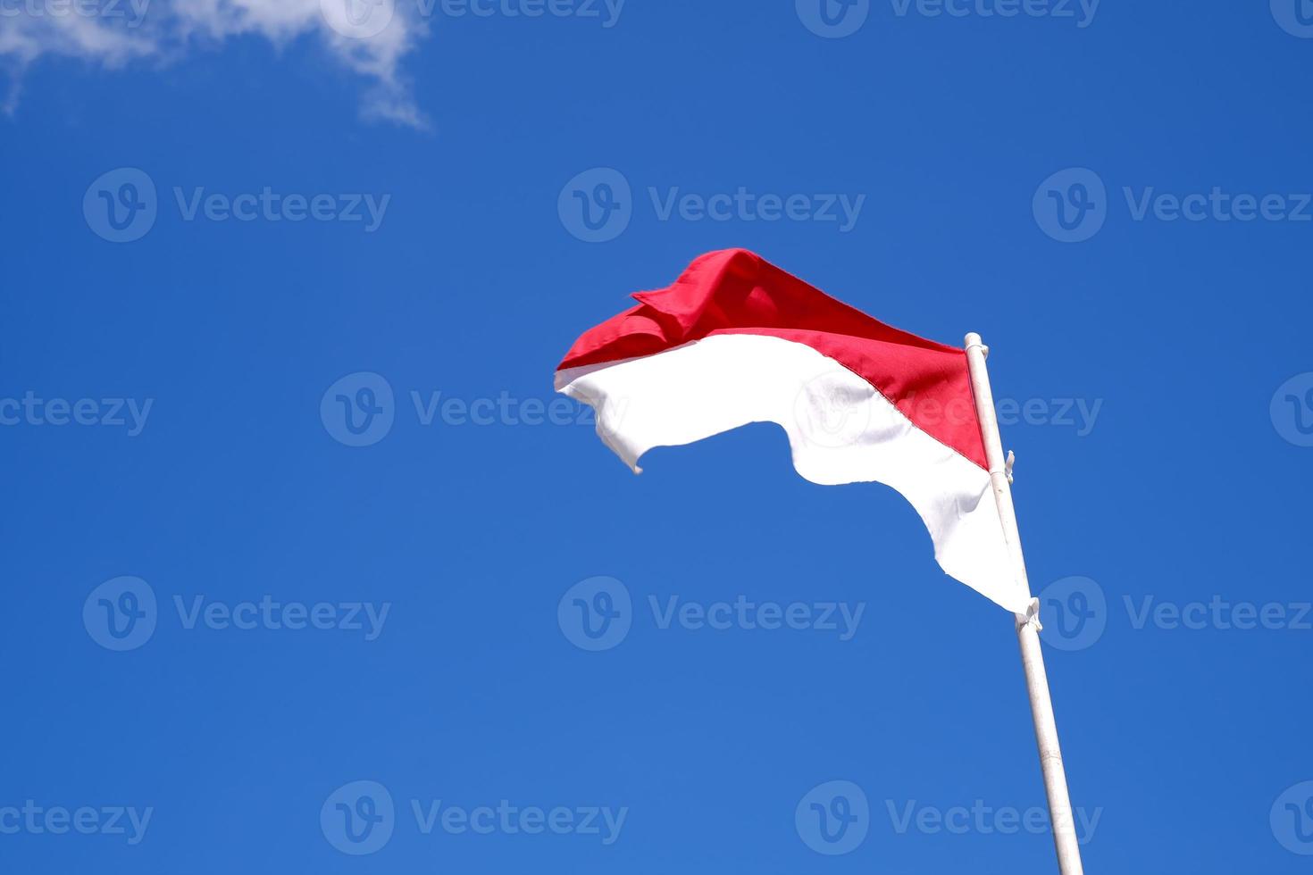 Indonesias red and white flag flying photo