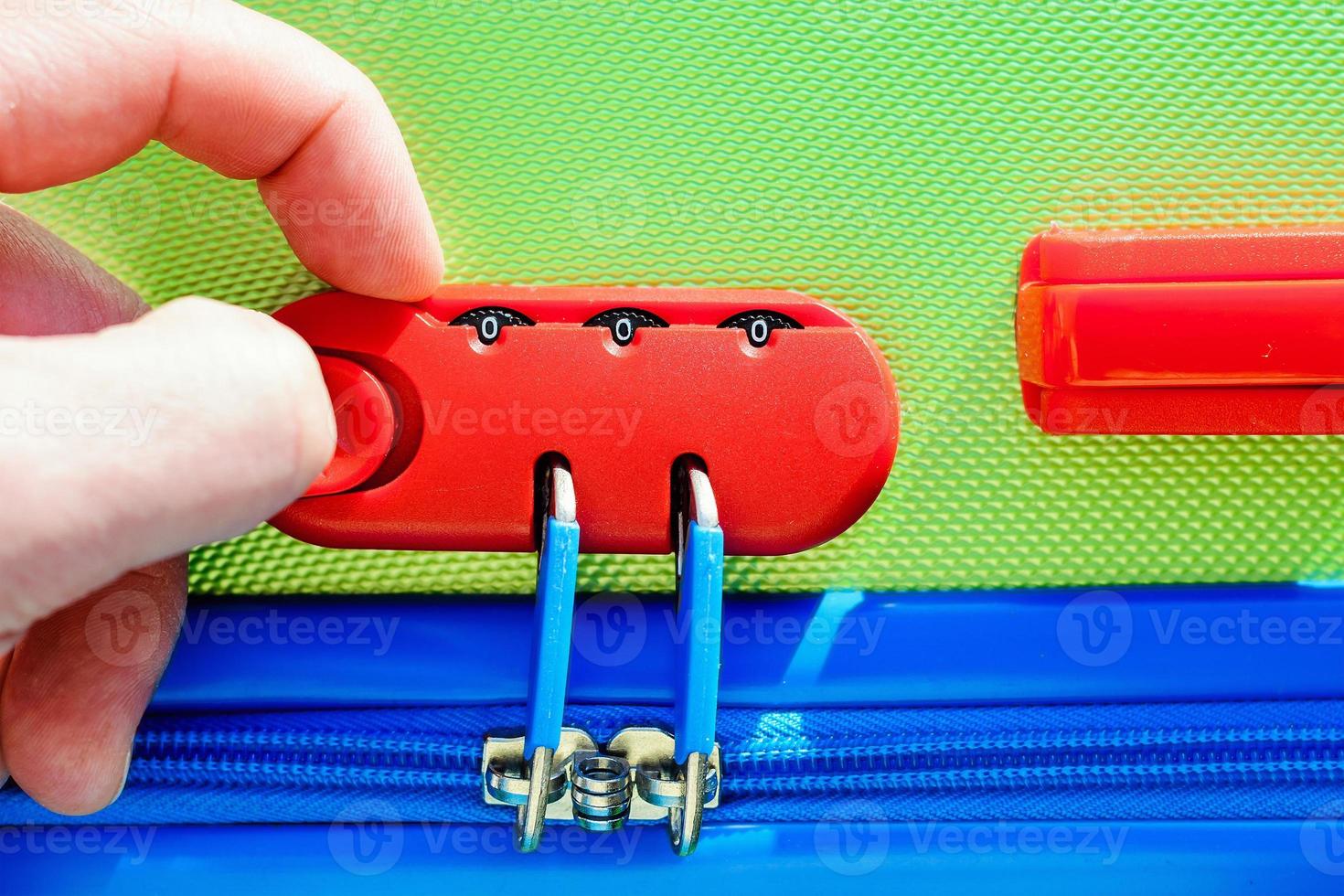 person opens a locking mechanism on the suitcase 5738066 Stock Photo at