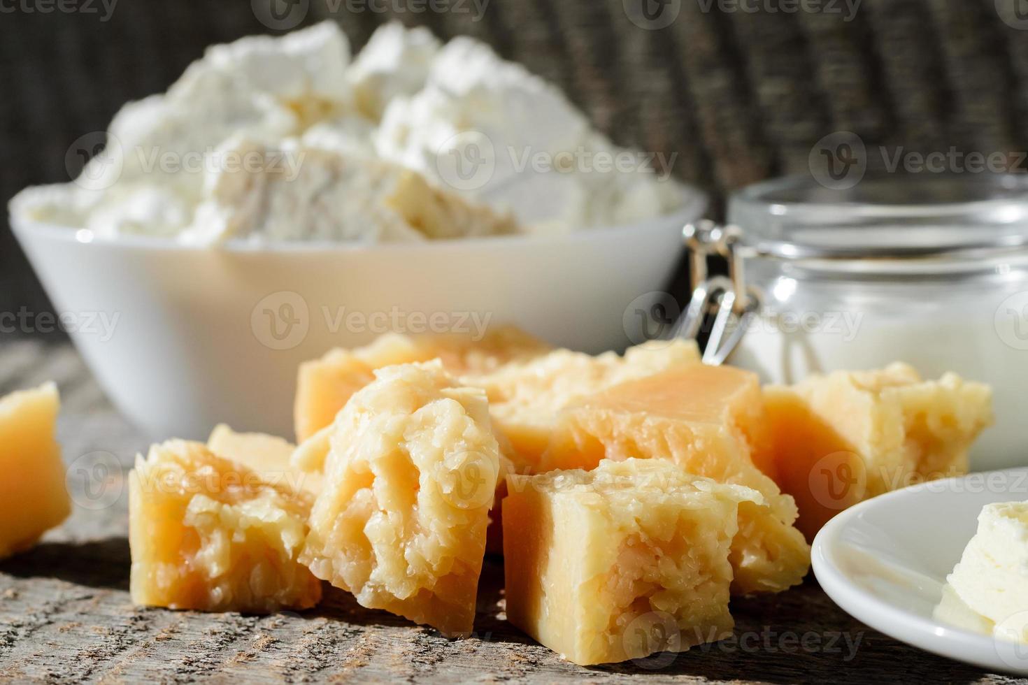 different kinds of fresh dairy products on a wooden table photo