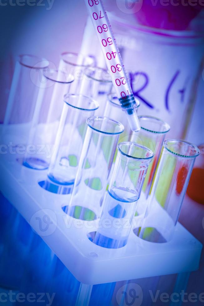 The test tubes and flasks with colored liquid in a laboratory photo