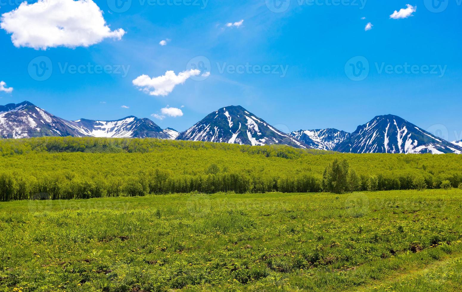 The summer landscape in mountains and the blue sky with clouds photo