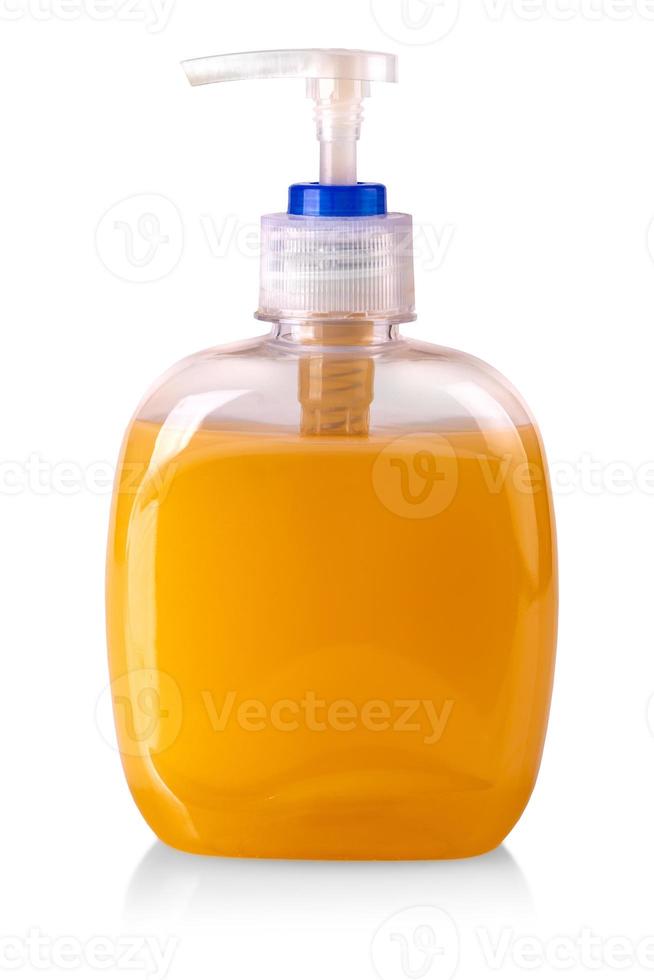 lastic bottle of the orange transparent liquid soap isolated on white background photo