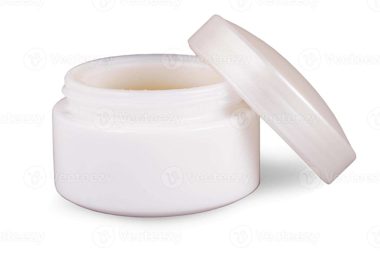 The opened face cream container isolated on white background photo