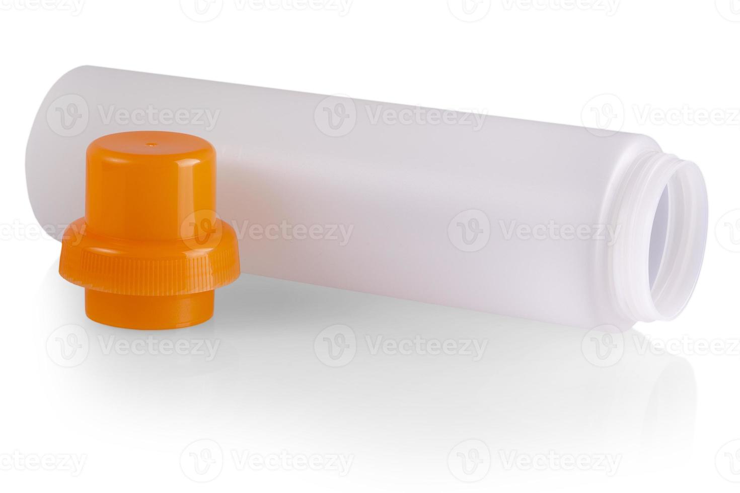 The white plastic bottle with a red cover on white background photo